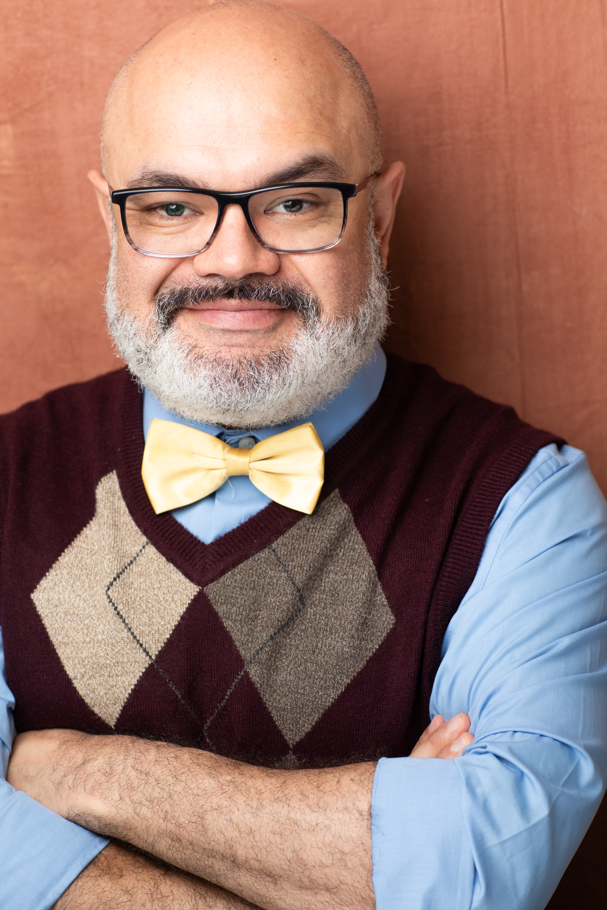 Erick Chavarria — theatrical headshot, warm lighting